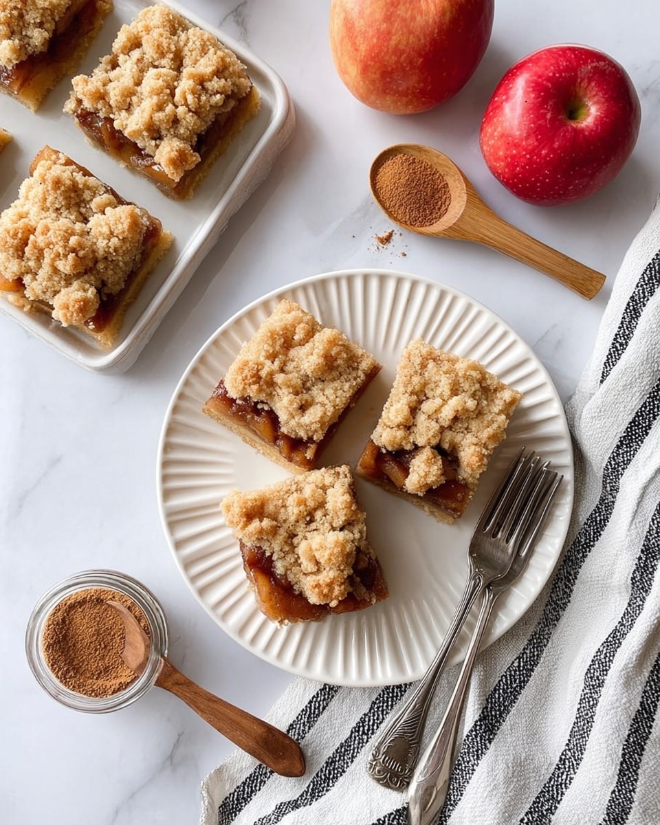 A metal pot contains sliced pale yellow apples sprinkled heavily with brown cinnamon in the first image. In the second image, the apples are now soaking in a dark brown sauce with a dollop of white flour added on one side, all inside the same metal pot. The third image shows the apples fully cooked and covered in thick, dark brown syrup in the metal pot. The fourth image displays the cooked apples spread evenly in a square white tray lined with light beige dough, resting on a white marbled surface. photo taken with an iphone --ar 4:5 --v 7
