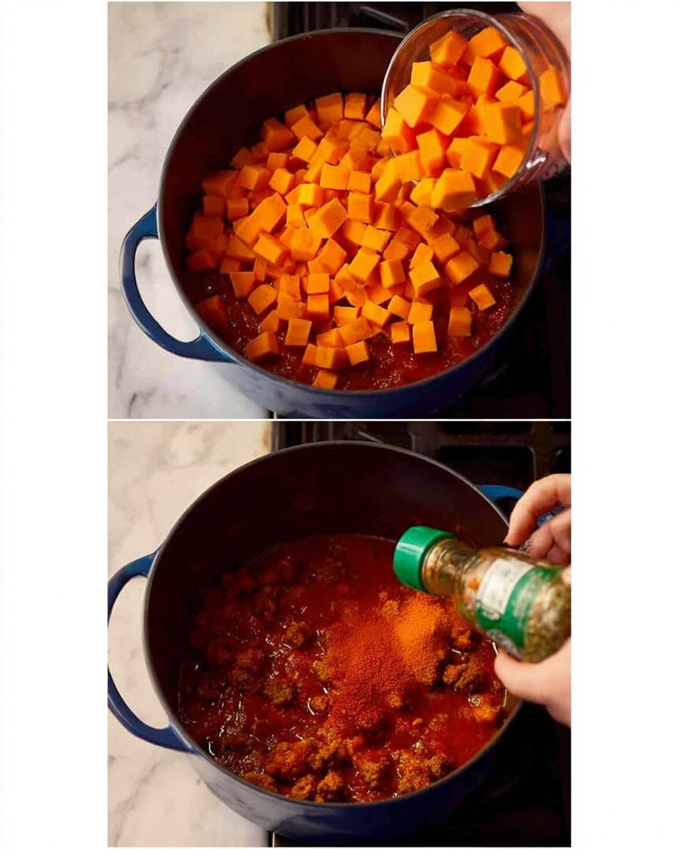 The image shows two close-up views of a dark blue pot on a stove with a tomato-based stew inside. In the top view, a woman's hand is pouring many small bright orange cubes, likely sweet potatoes, into the pot filled with red sauce. The cubes form a thick layer on top of the sauce. In the bottom view, the stew now has added small browned meat pieces mixed with the sauce and orange cubes, and another woman's hand is shaking a green-capped bottle to pour dark red powder, probably chili or paprika, over the mixture in the pot. The pot is the same dark blue in both images, and the background is a white marbled surface photo taken with an iphone --ar 4:5 --v 7