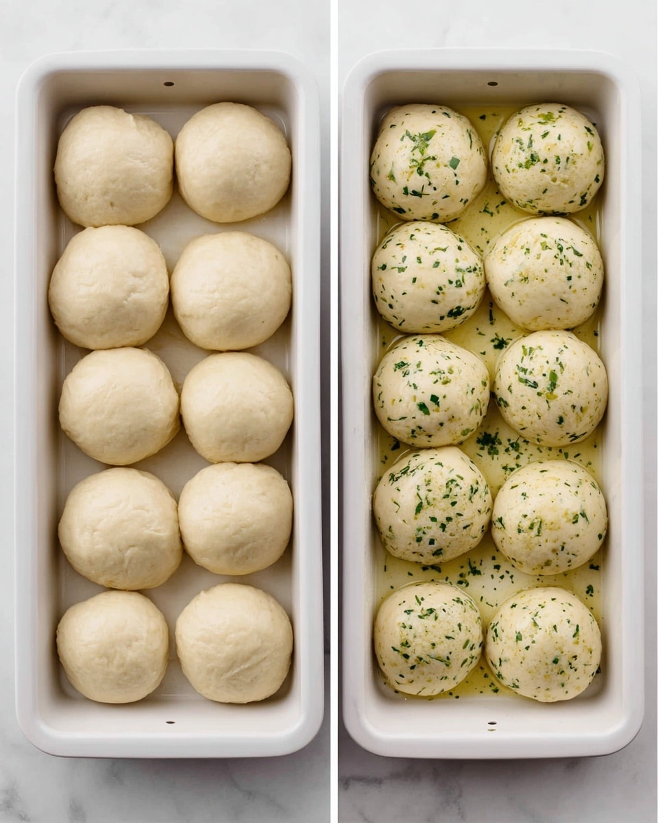The image shows two white baking trays side by side on a white marbled surface. Each tray holds 12 round dough balls arranged in a 3x4 grid. The dough balls are pale cream in color and smooth in texture. The left tray has plain dough balls, while the right tray's dough balls are sprinkled with small bits of green herbs and lightly coated in oil, giving them a shiny appearance. The trays themselves have a clean, simple look and the lighting highlights the soft texture of the dough. photo taken with an iphone --ar 4:5 --v 7