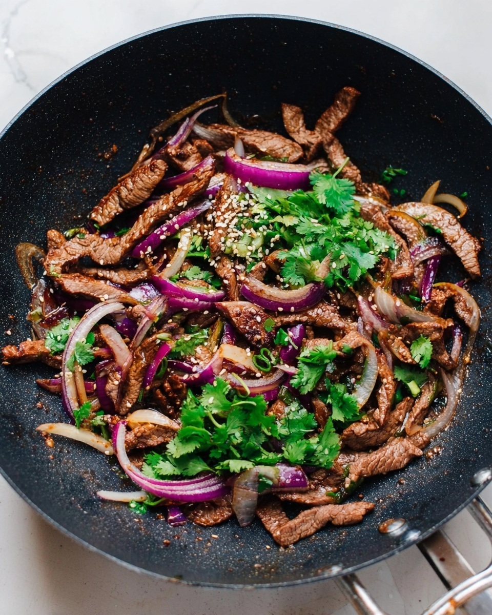 A black wok filled with cooked thin strips of brown meat mixed with sliced purple and white onions, sprinkled with white sesame seeds and topped with fresh bright green cilantro leaves. The wok sits on a white marbled surface with a metal spatula visible on the right. The textures show soft cooked onions, tender meat, and fresh herbs on top, creating a colorful contrast. photo taken with an iphone --ar 4:5 --v 7
