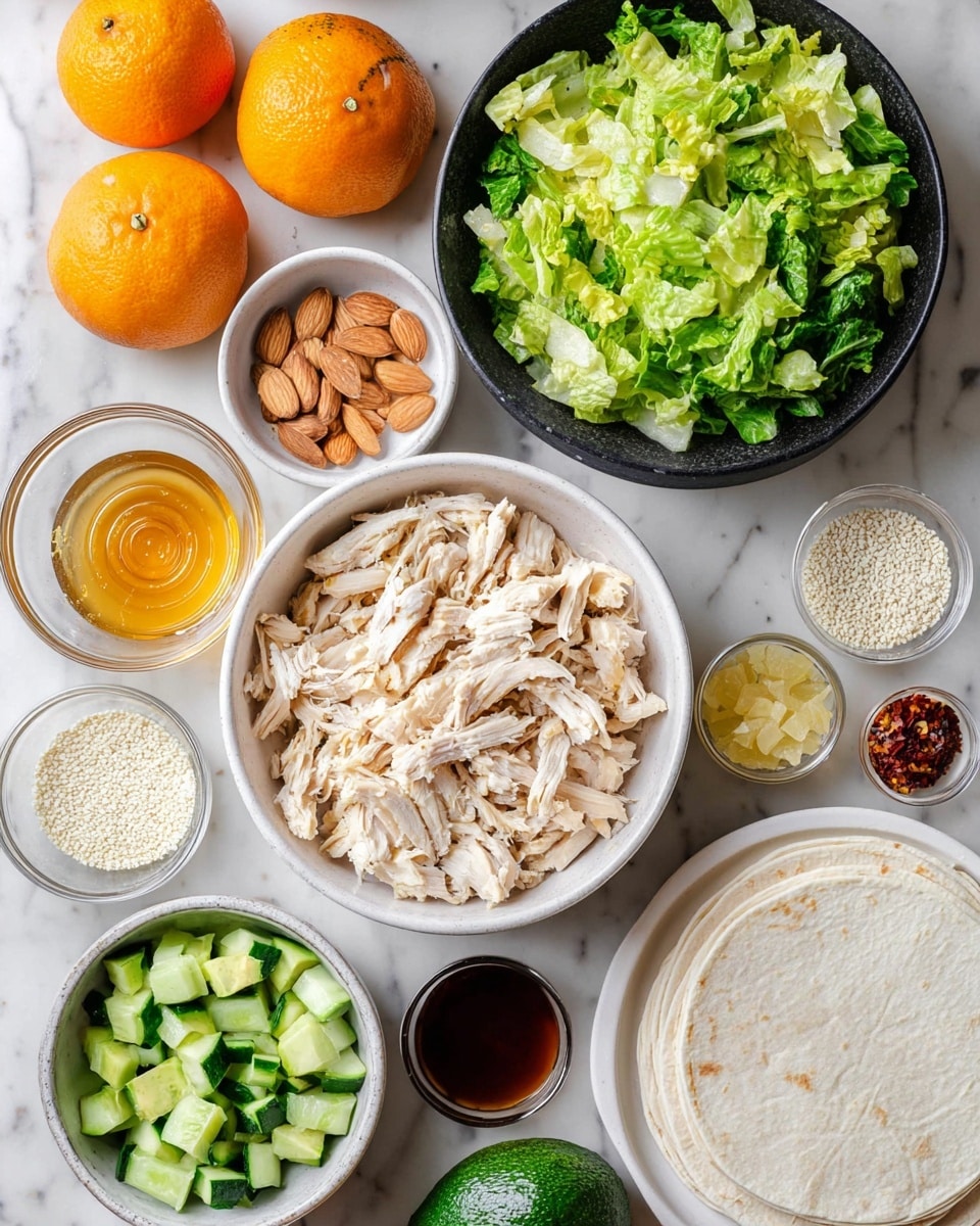 A flat lay showing a white bowl in the center full of shredded light beige chicken pieces with slight golden edges. Above it, a large round black bowl filled with bright green chopped leafy lettuce. To the upper left side, three whole bright orange mandarins, and next to them a white bowl with light brown almond slices. Below the mandarins is a small round bowl of honey with a golden amber shine. To the lower left, a whole dark green avocado sits beside a white bowl filled with chopped light and dark green cucumber pieces. Around the main bowl of chicken are small clear glass bowls filled with pale white sesame seeds, light yellow liquid, coarse white salt, and mixed red chili flakes with light pink salt crystals. A white plate with off-white stacked thin wraps or flatbreads is placed on the lower right side. In the middle bottom, a white wavy small bowl holds dark amber honey. The background is a white marbled texture. Photo taken with an iphone --ar 4:5 --v 7