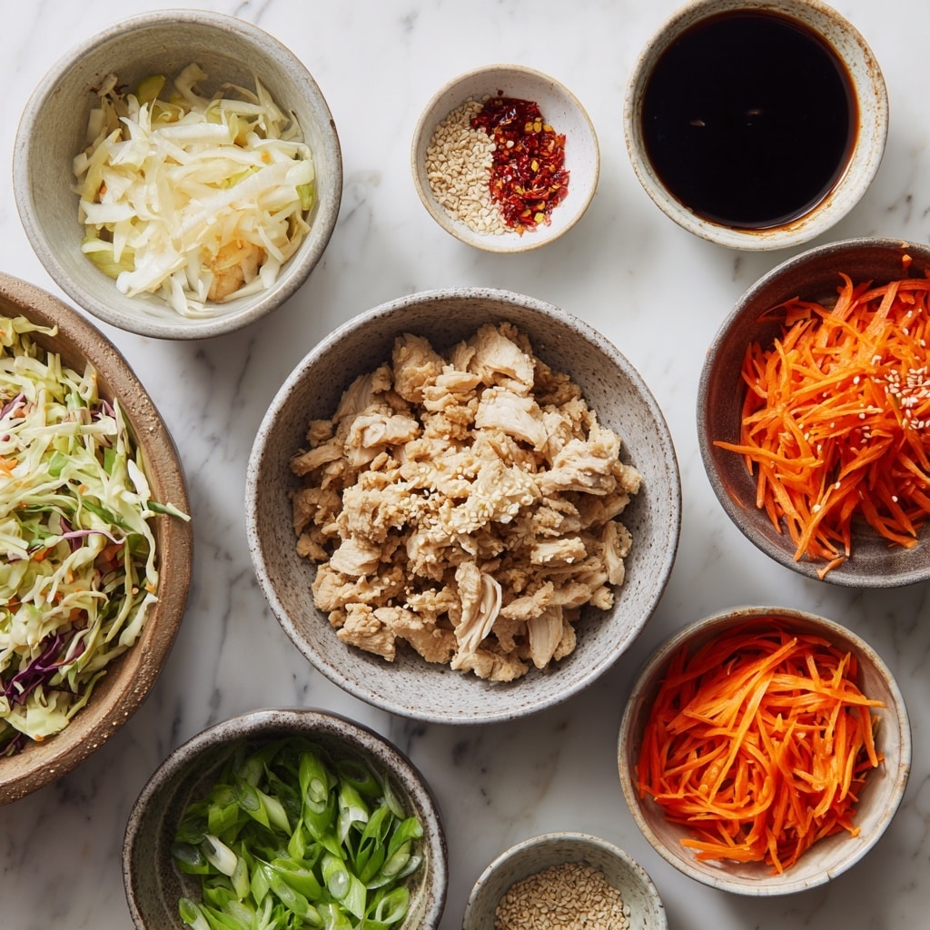 A white bowl filled with a clear broth soup, containing ground meat in small chunks spread throughout the bowl. Thin, soft cabbage pieces and thin orange carrot strips are mixed in, adding texture and color. On top, bright green chopped scallions and white sesame seeds are sprinkled, with a few red flakes for spice. The broth looks slightly oily with small bubbles on the surface, showing warmth and freshness. The bowl is placed on a white marbled surface. photo taken with an iphone --ar 4:5 --v 7