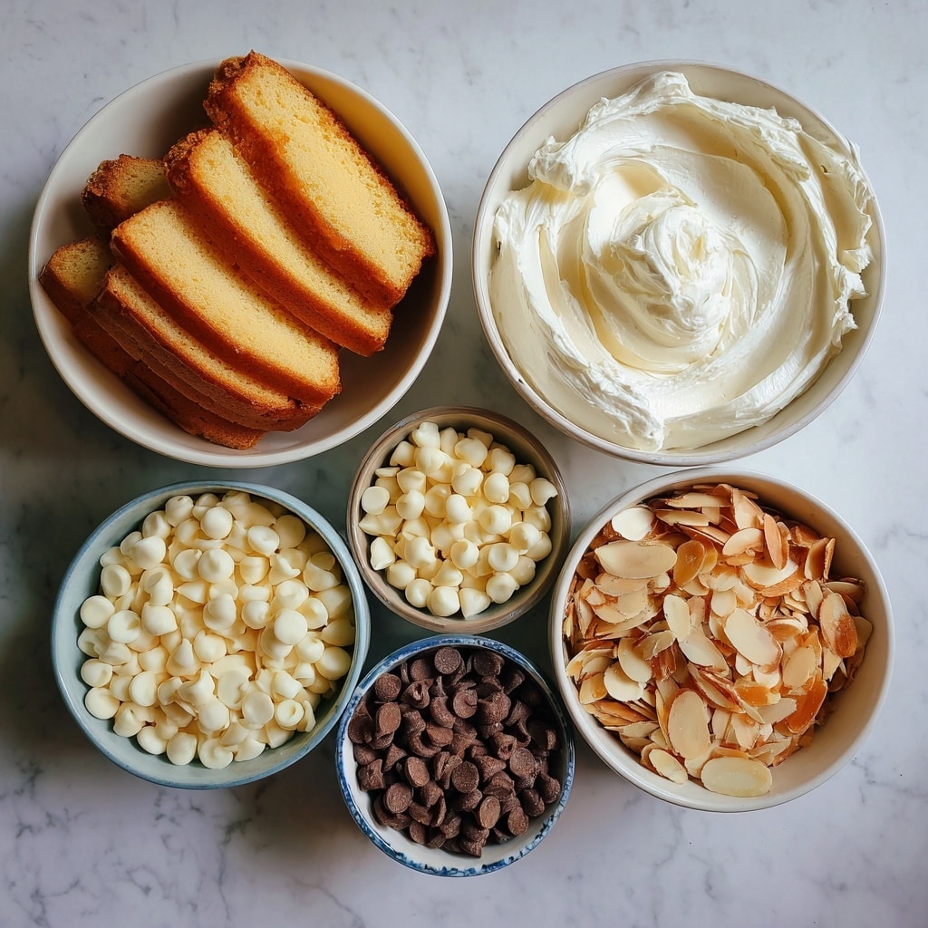 A white rectangular plate holds twelve small square treats arranged in a 4 by 3 grid. Each treat has a light golden base layer and is coated in pastel pink or light lavender icing. Some of the treats have smooth icing with white or pink drizzle lines on top, while others are decorated with small, coarse sugar crystals or small candy pieces in pink and white. The treats show soft, rounded edges and have a neat, delicate look. The plate sits on a white marbled surface, with a partial view of a white cup in the background. photo taken with an iphone --ar 4:5 --v 7