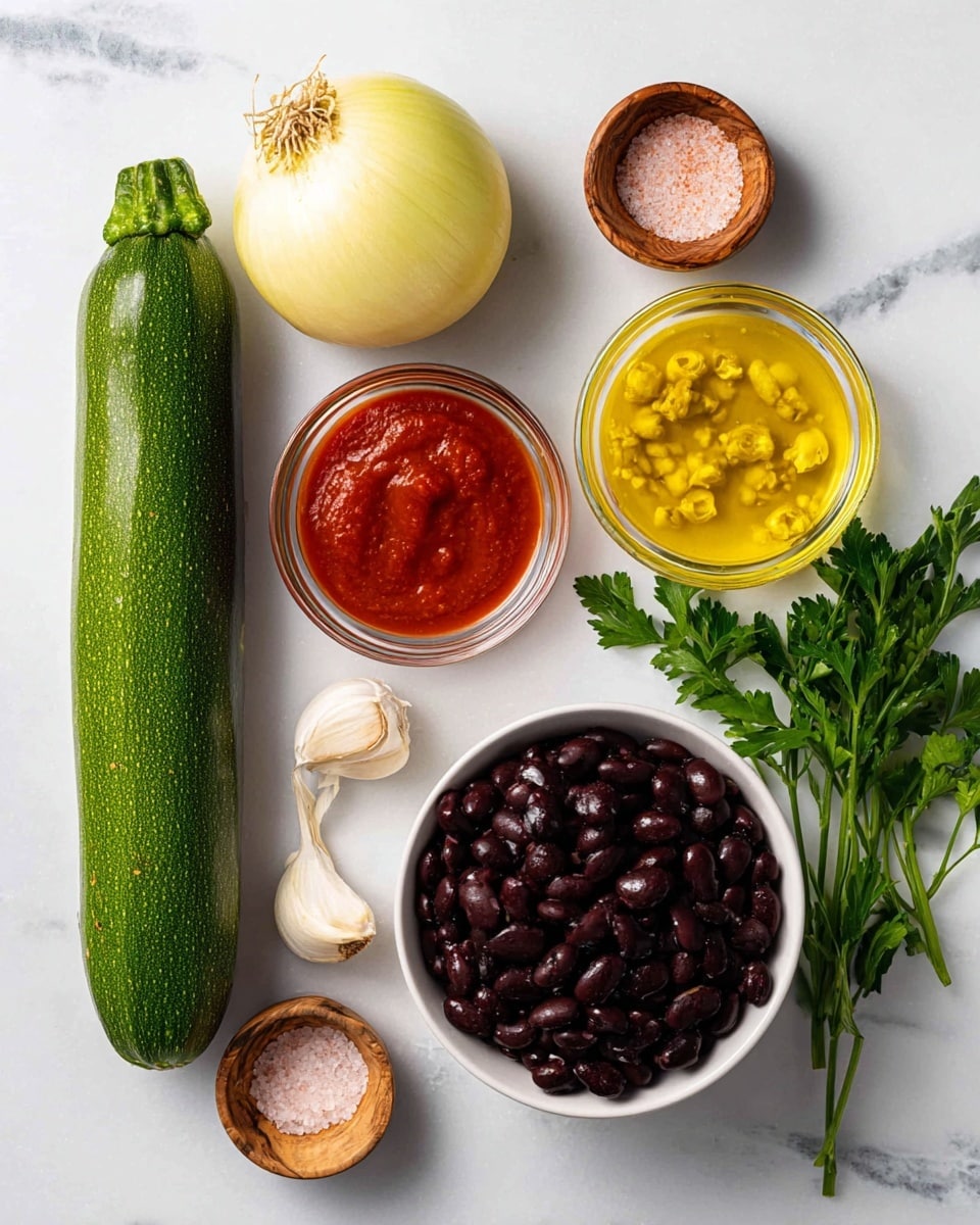 The image shows seven fresh and raw cooking ingredients neatly arranged on a white marbled surface. On the left, there is a whole green zucchini placed vertically. Above it, a whole light yellow onion with its root end visible. Next to the zucchini and onion, there are small clear glass bowls containing bright red tomato paste, smooth reddish-brown sauce, yellow chopped peppers in liquid, and a golden yellow oil. To the top right, a white bowl filled with dark purple black beans sits surrounded by a few sprigs of green parsley and three cloves of garlic. A small wooden bowl with light pink salt completes the setup, all presented with a clean, bright look. Photo taken with an iphone --ar 4:5 --v 7