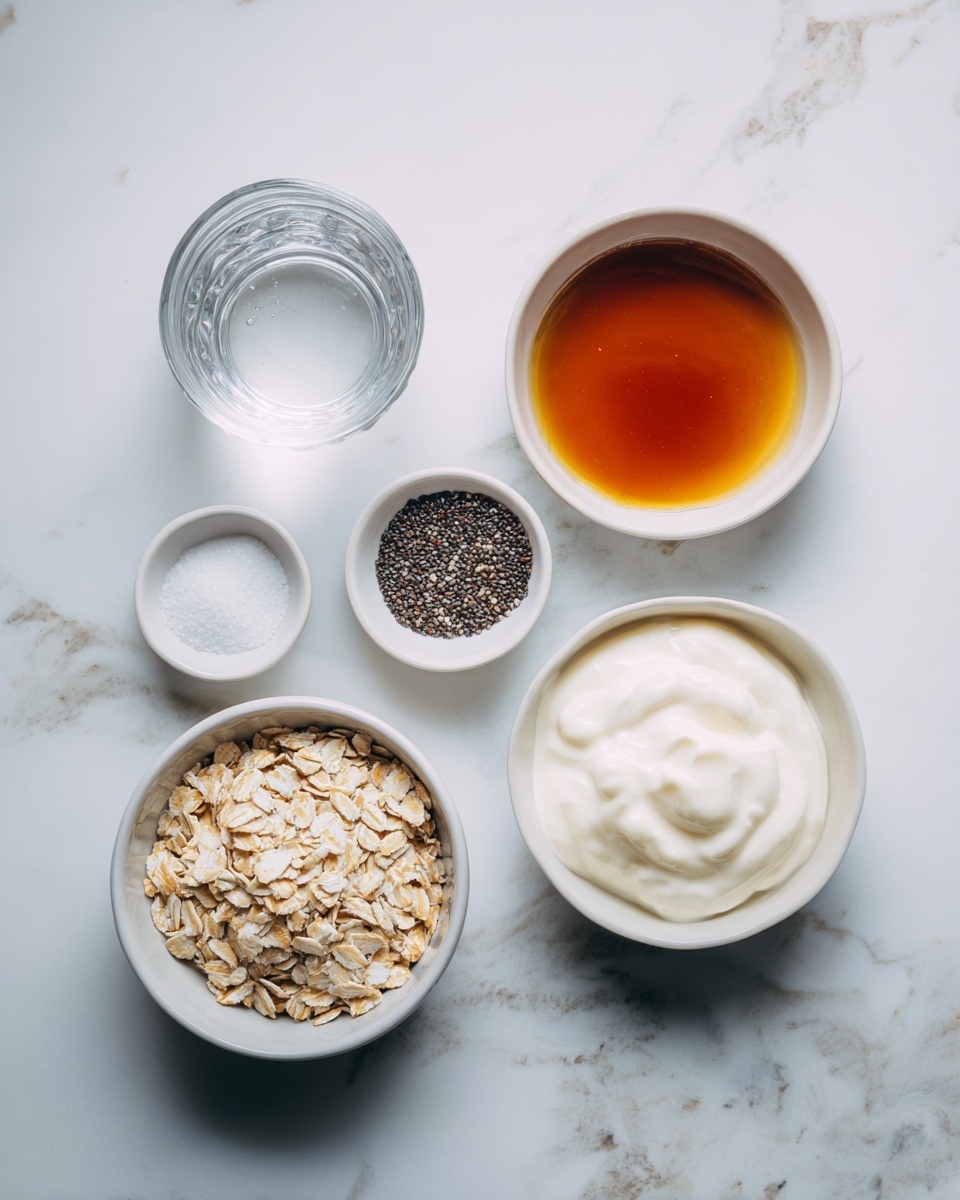 The image shows six small white bowls and a glass cup placed on a white marbled surface. The top left has a clear glass of water, next to it on the right is a small white bowl filled with dark amber maple syrup. Below the water glass is a small white bowl containing fine salt. To the right of that is a white bowl with small black and white chia seeds. Below the salt bowl and chia seeds bowl are two medium-sized white bowls; one filled with light-colored rolled oats showing a dry and flaky texture, and to its right, a white bowl with a smooth and creamy white yogurt. Each bowl is clearly labeled with black text pointing to the contents. photo taken with an iphone --ar 4:5 --v 7
