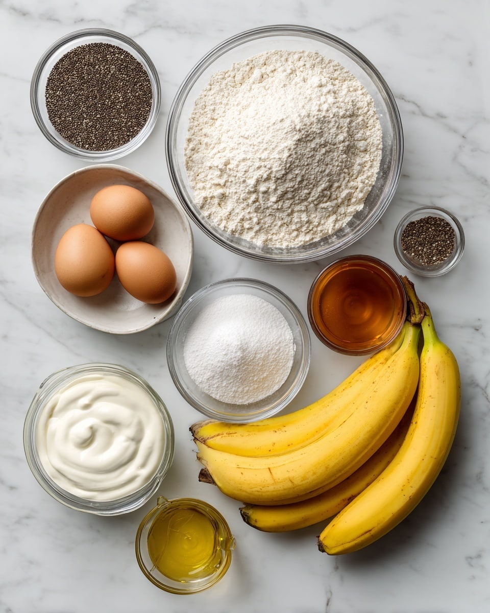The image shows several clear bowls and measuring cups arranged in a loose circle on a white marbled surface, each containing different baking ingredients. At the top center is a large bowl filled with white flour, to the right of it is a smaller bowl with two brown eggs. Below the eggs is a bowl with white powder (baking powder, baking soda, salt). Underneath is a small cluster of three yellow bananas with slight brown spots. To the left of the bananas is a clear measuring cup filled with a thick white creamy substance labeled Greek yogurt. Above the yogurt is a small bowl filled with tiny black chia seeds. Next to the chia seeds is a clear bowl filled with amber maple syrup. In the center is a small metal measuring cup containing light yellow oil, and next to it is a tiny glass bowl holding brown vanilla extract. The ingredients are spaced evenly and clearly labeled, all set on a clean white marbled background. Photo taken with an iphone --ar 4:5 --v 7